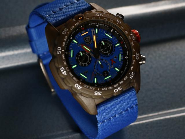 a blue clock sitting on the side of a watch