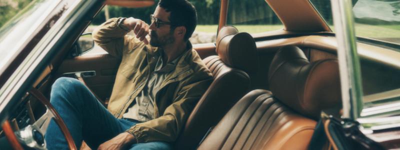 a man sitting in a car