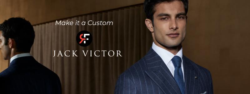 a man wearing a suit and tie looking at the camera