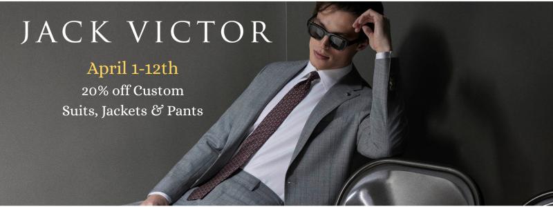 a man wearing a suit and tie talking on a cell phone