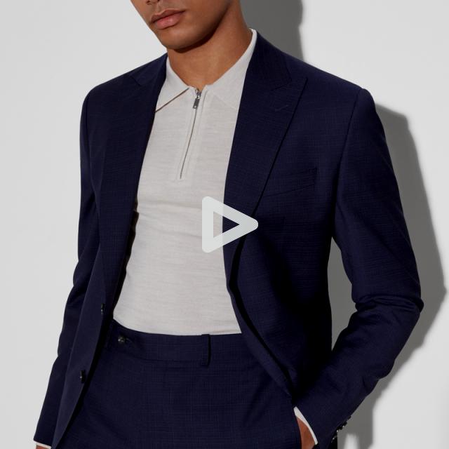a man wearing a suit and tie