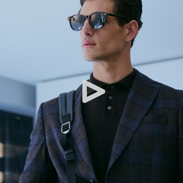 a man wearing sunglasses posing for the camera